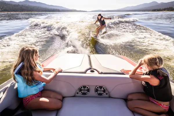 Passengers spotting for the wakesurfer